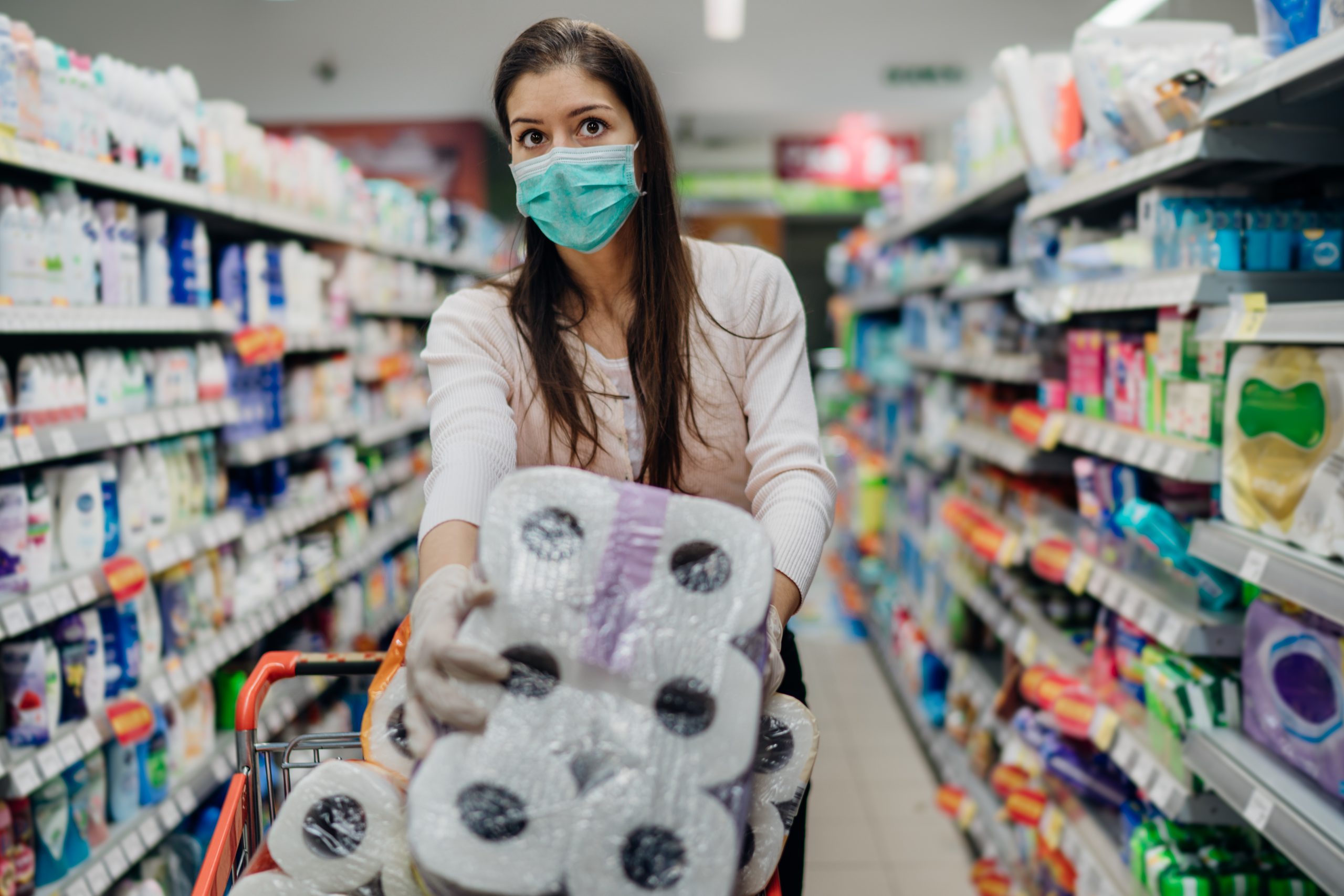 A prepper woman buys toilet paper