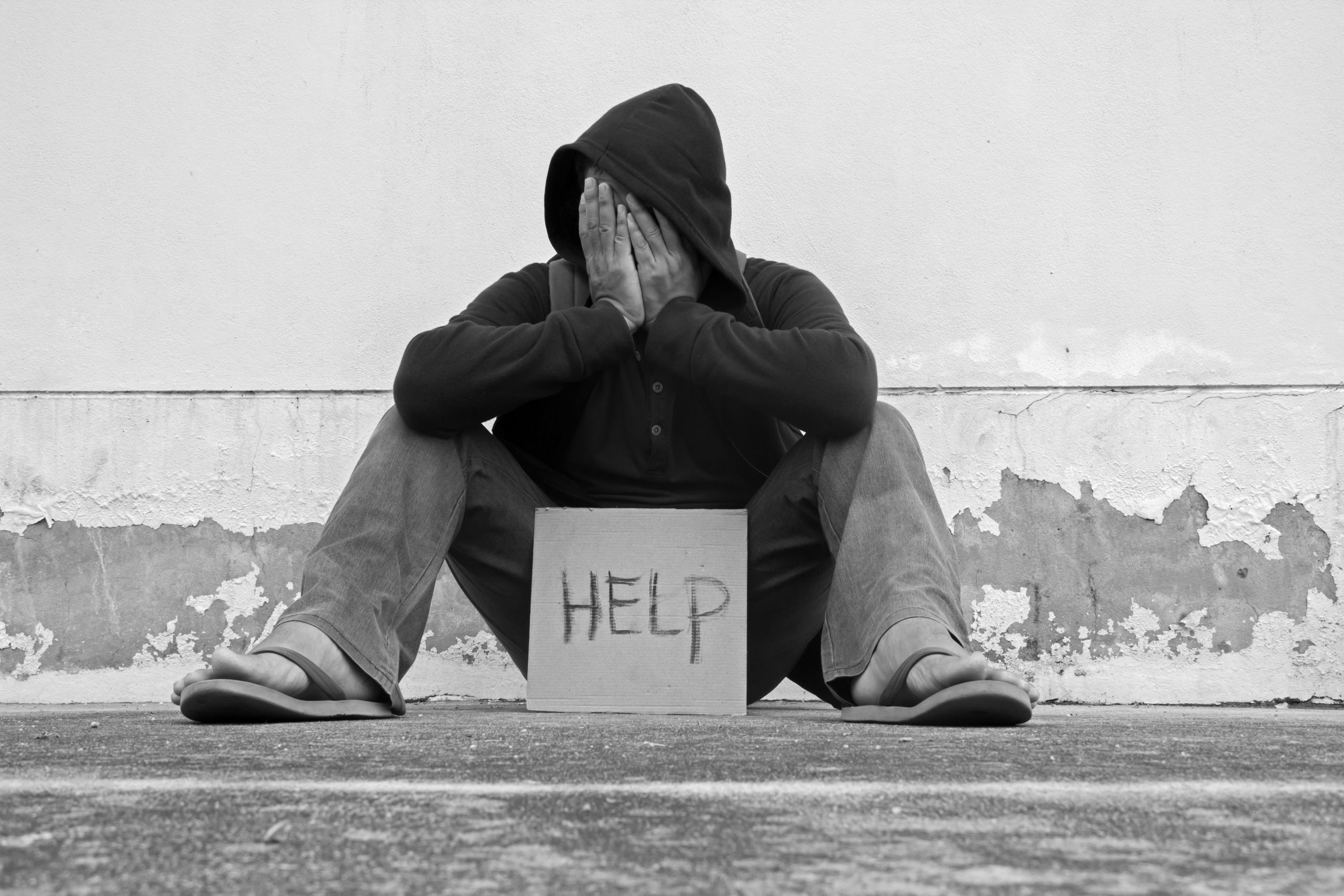 Man seeking help and handout on street corner