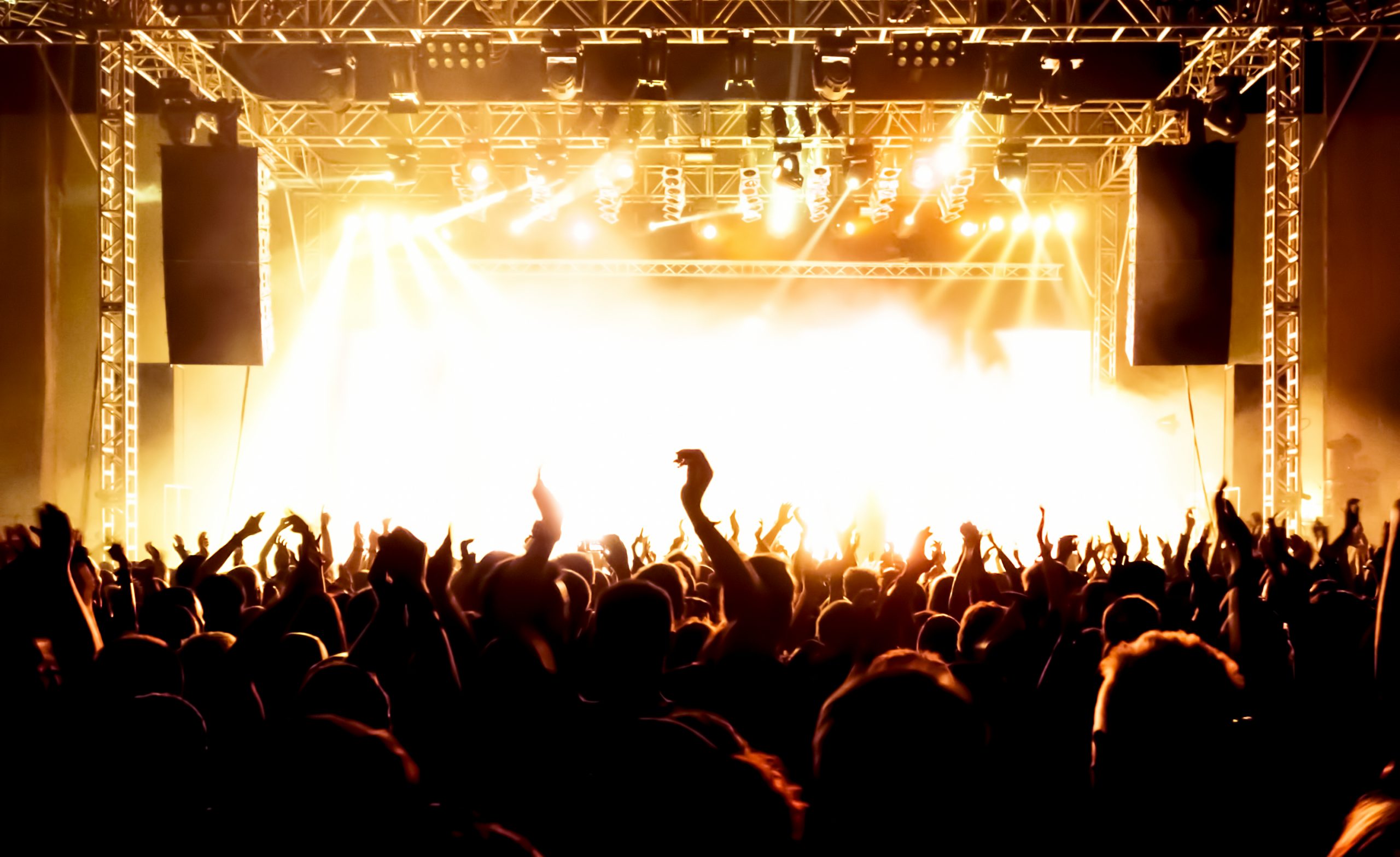 live rock concert with pyro technic engulfed stage during the recording of the best live albums