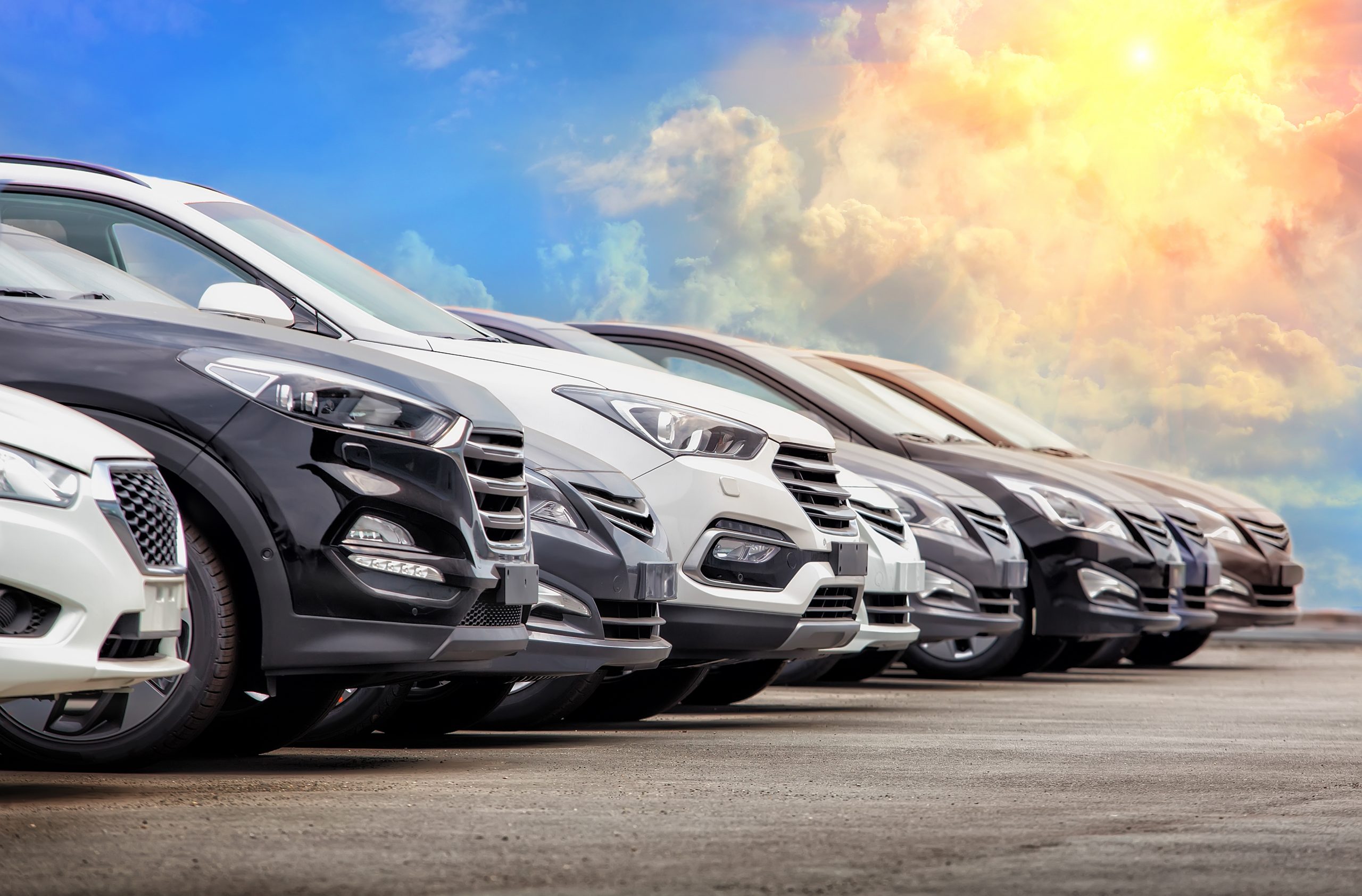 A row of new cars and suvs