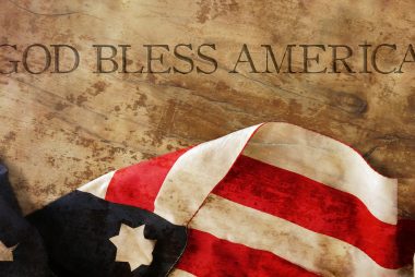 American flag on parchment that says God Bless America