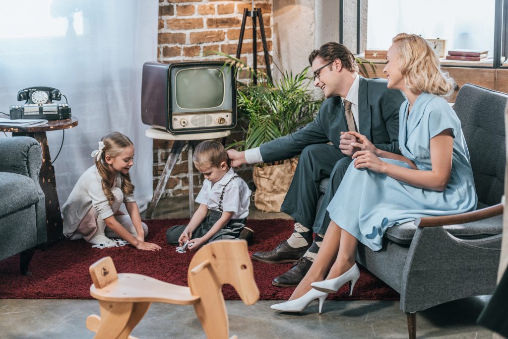 Family from the 50's around the TV set representing the Good Old Days