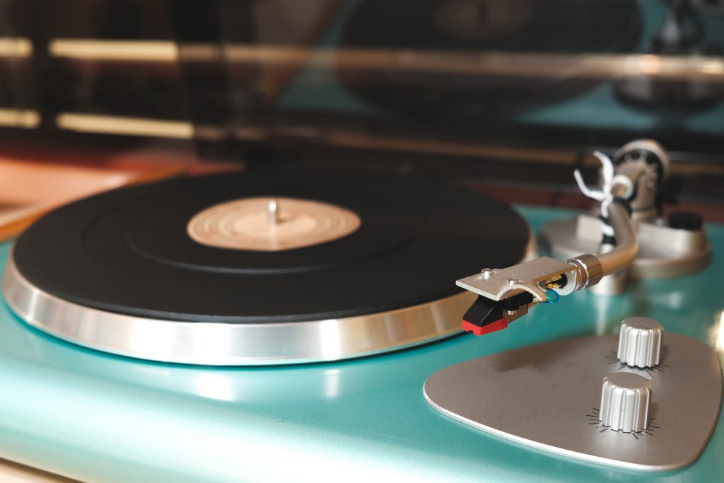 a record turntable featuring a debut albums ready for playing.