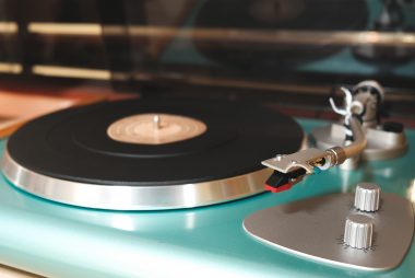 a record turntable featuring a debut albums ready for playing.