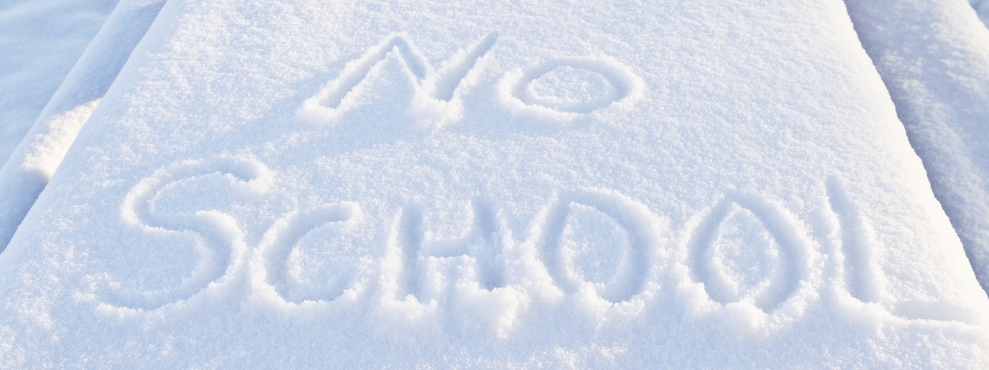 The words "no school" written in the snow due to a snow day.